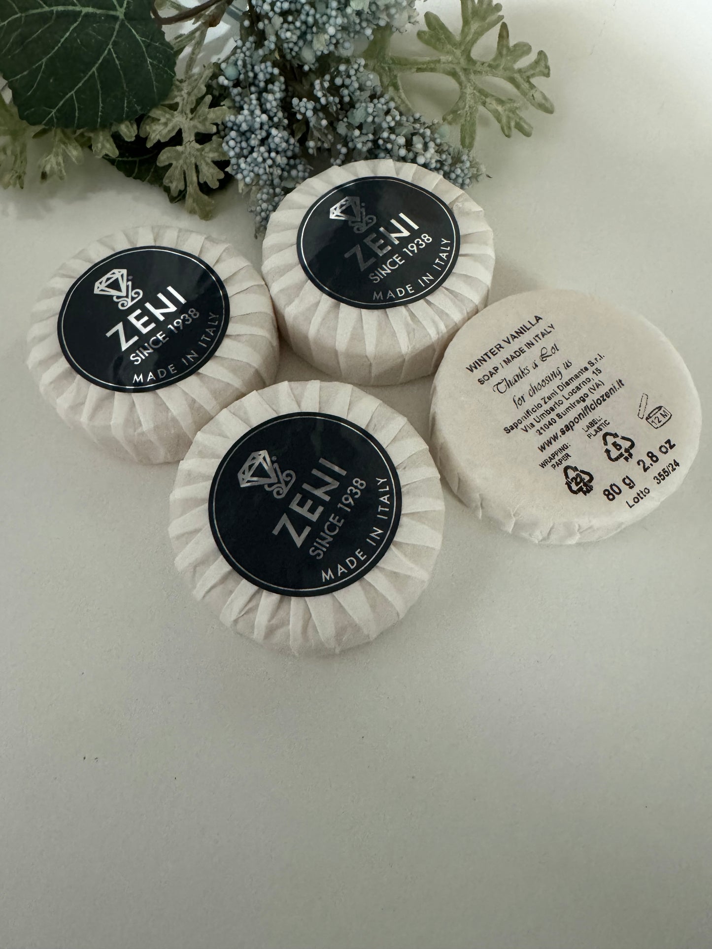 Set of Winter Vanilla scented round soap bars displayed with light seasonal decor, ideal for gifting