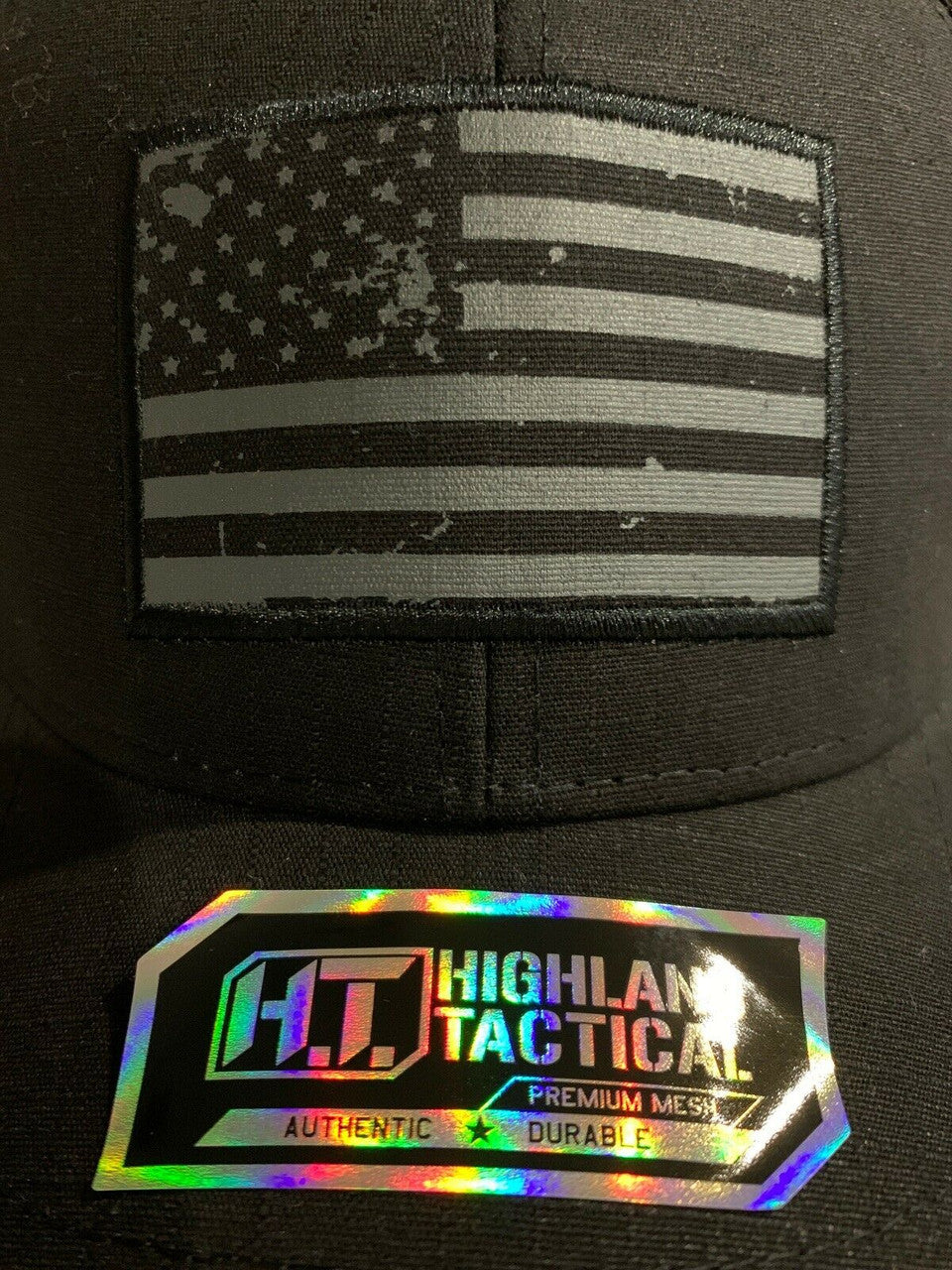 HIGHLAND TACTICAL black mesh snapback trucker hat with USA flag patch and adjustable closure
