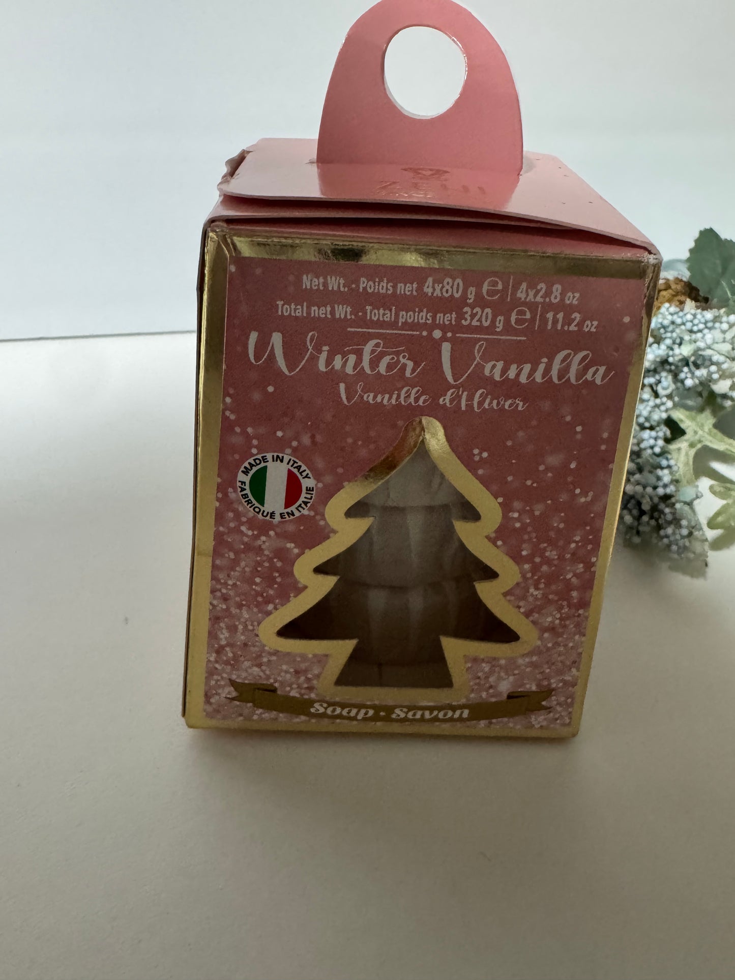 Full front view of Winter Vanilla holiday soap gift set with pink tree-shaped packaging and handle