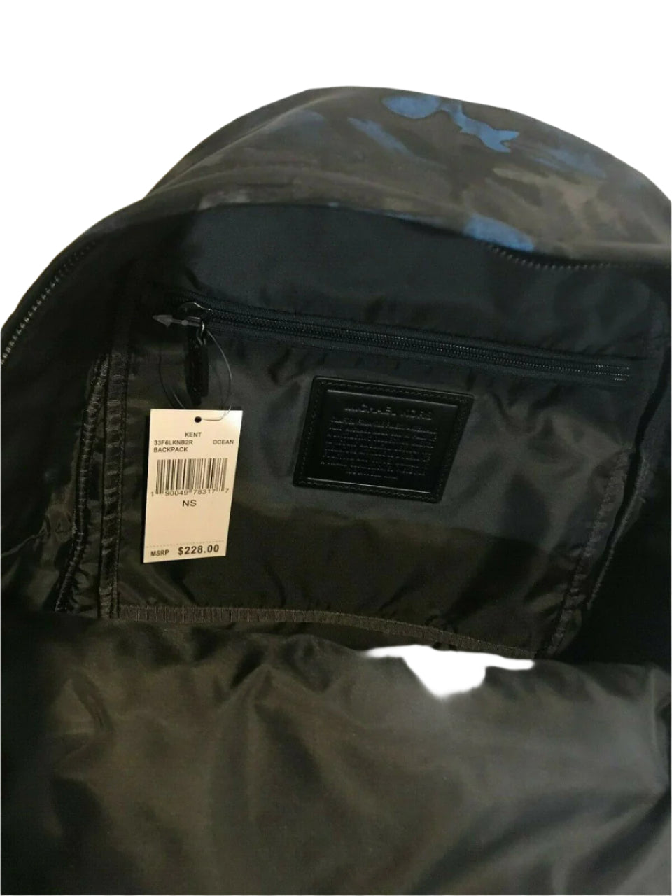 Men’s midnight camo backpack with nylon exterior, leather trim, and padded shoulder straps