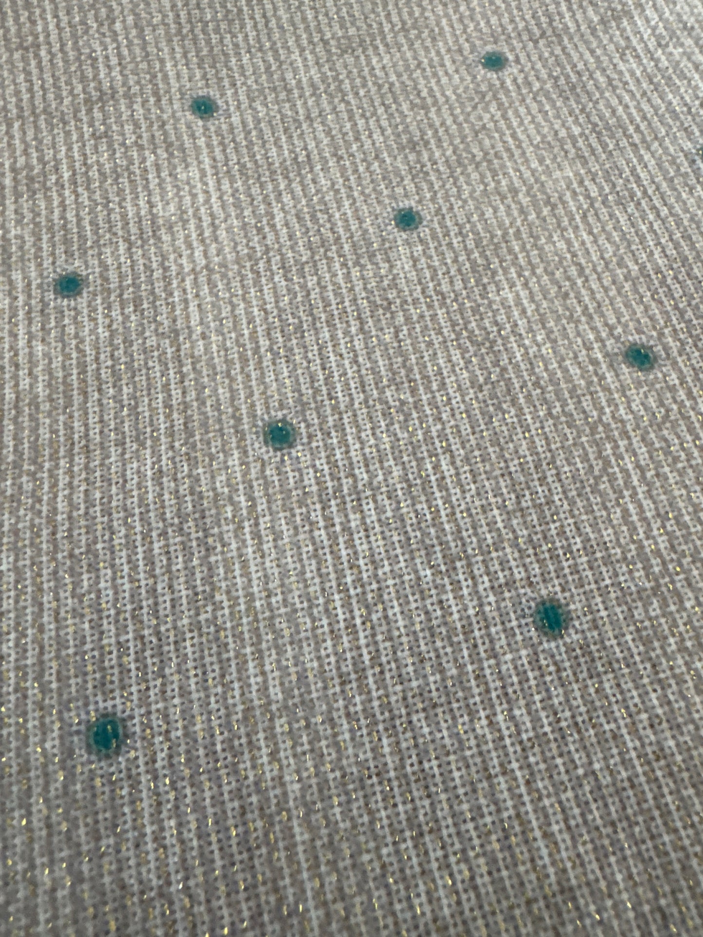 Close-up of a set of 8 vibrant, peacock-themed napkins with intricate lurex and printed designs. Each napkin is elegantly crafted from polyester with metallic fibers, showcasing a festive and luxurious touch with a rich color palette