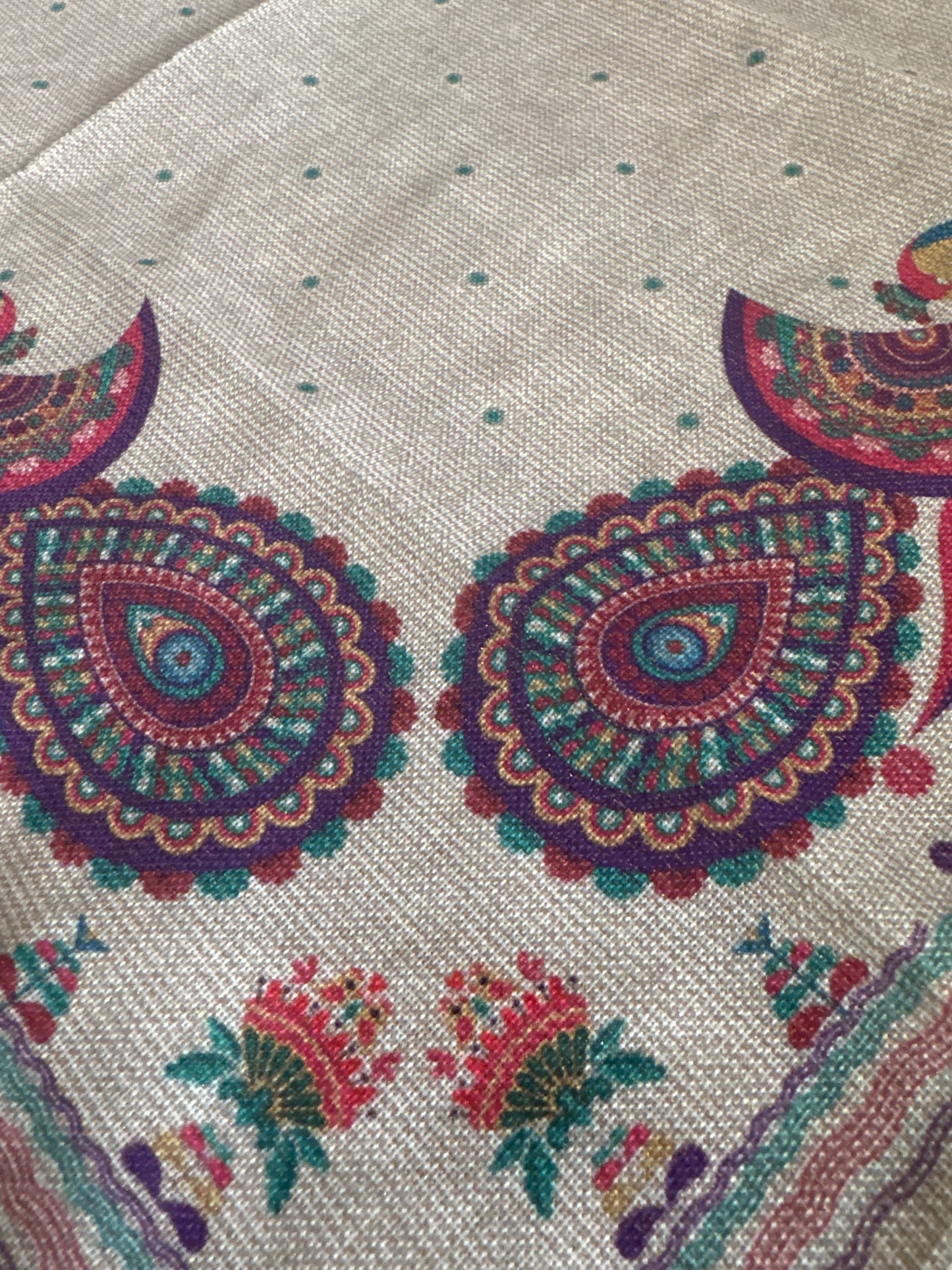 Close-up of a set of 8 vibrant, peacock-themed napkins with intricate lurex and printed designs. Each napkin is elegantly crafted from polyester with metallic fibers, showcasing a festive and luxurious touch with a rich color palette