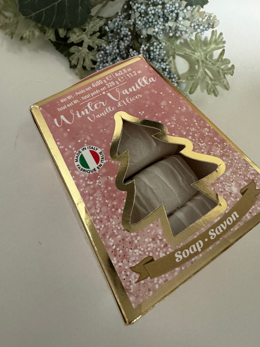 Holiday gift soap set in pink and gold tree-shaped box, Winter Vanilla scent, placed with festive greenery