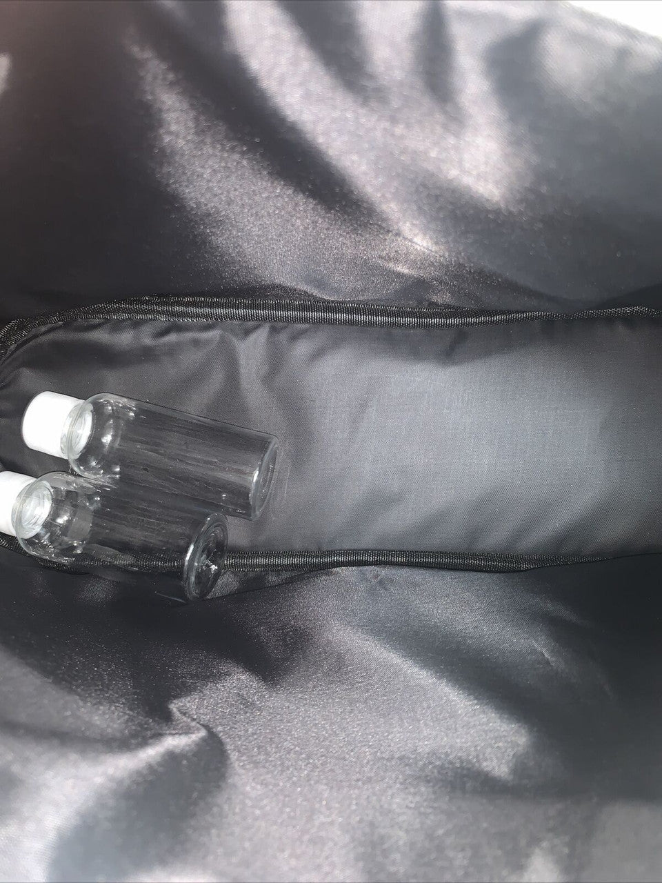 Bebe Cosmetic Travel Bag with 2 travel toiletry bottles Black And White