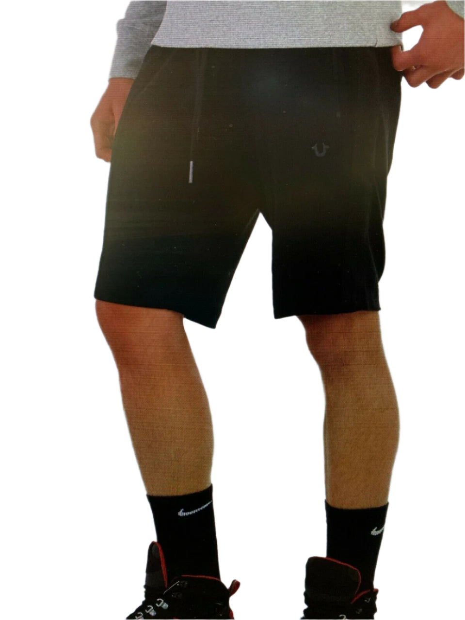 Men’s off-white logo shorts with drawstring waist, zip pockets, and horseshoe logo – shown on model