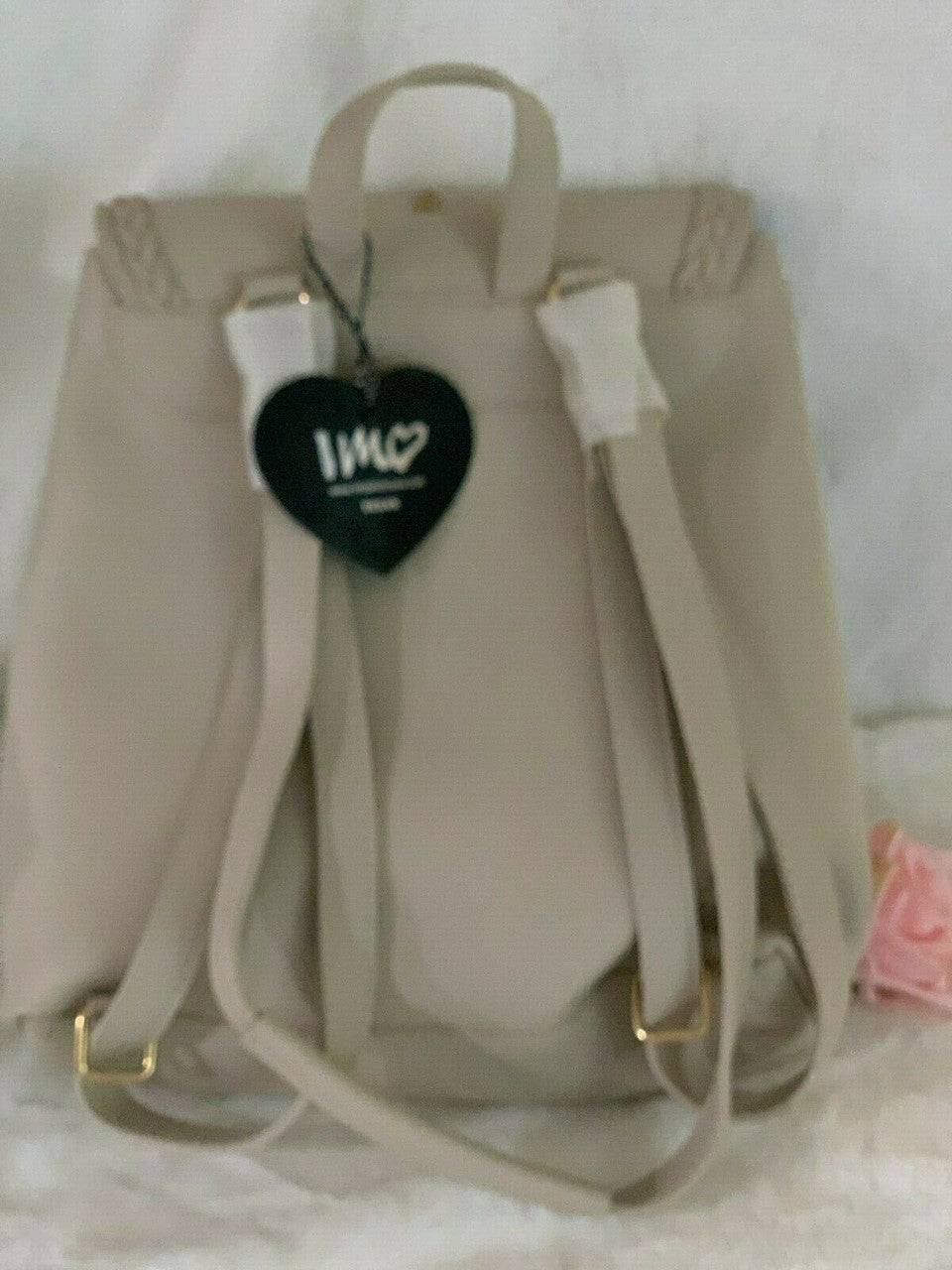 IMOSHION stone convertible backpack with tassel accent and flap front