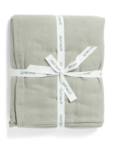 IBENA queen-size organic cotton blanket in asphalt gray, folded and tied with white ribbon – 90 x 90 inches