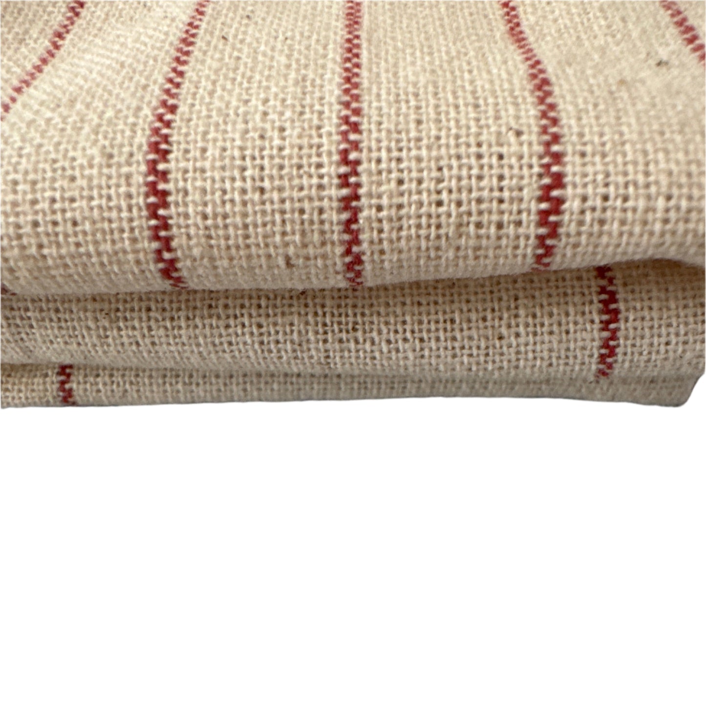 Stacked beige woven fabric with red parallel stripes, showcasing its textured surface and neatly folded edges on a white background.